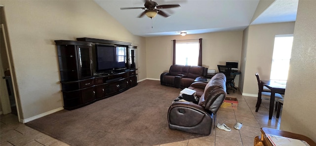 living room featuring vaulted ceiling, light colored carpet, and ceiling fan