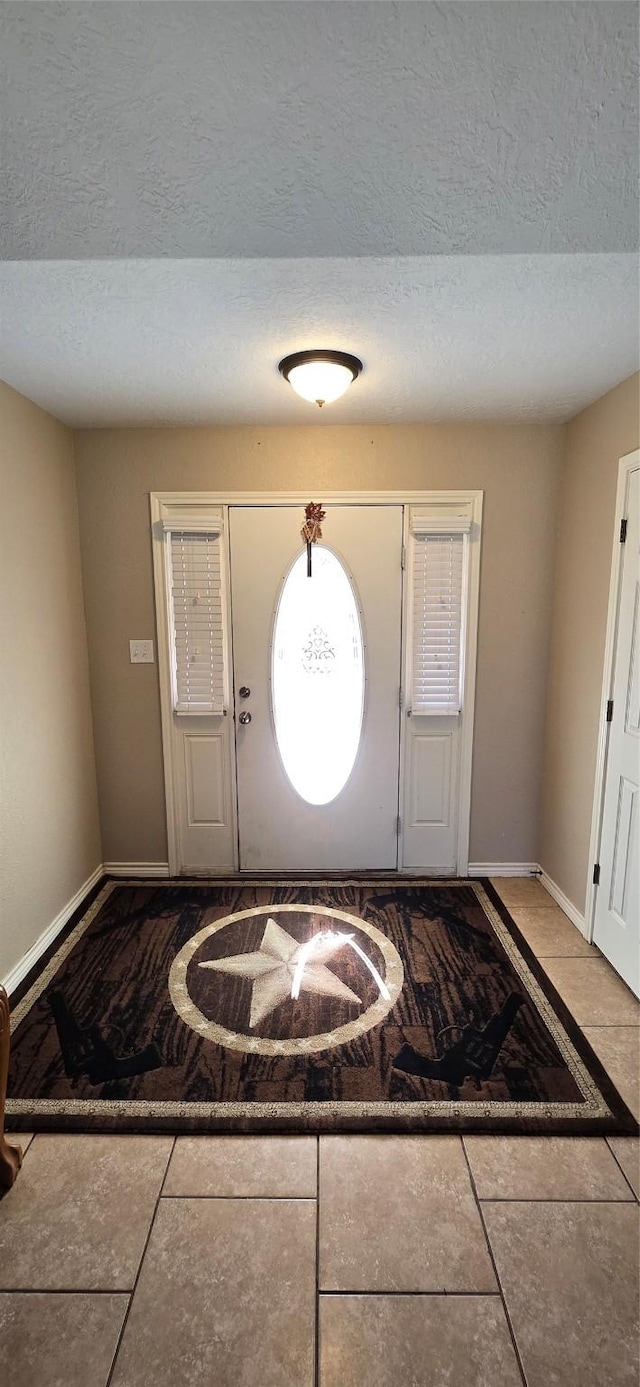 entryway featuring a textured ceiling