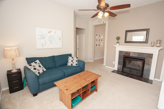 living room with ceiling fan, a fireplace, and carpet