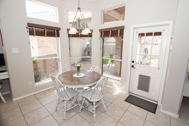 tiled dining area with a notable chandelier