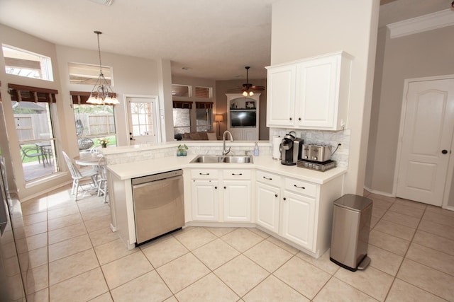 kitchen featuring tasteful backsplash, white cabinetry, dishwasher, sink, and kitchen peninsula