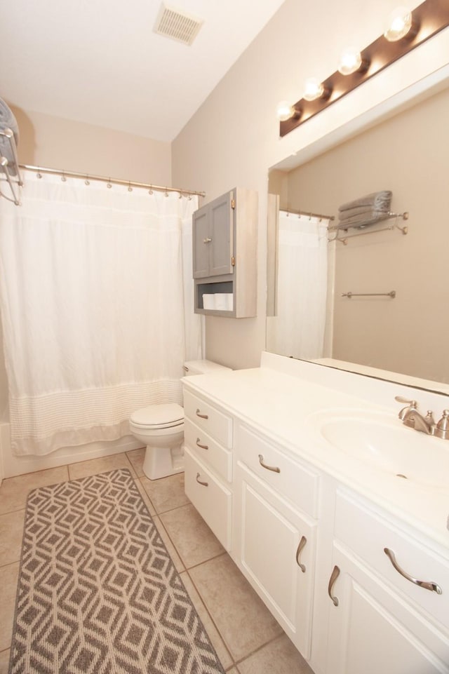 full bathroom featuring vanity, tile patterned floors, shower / bath combination with curtain, and toilet