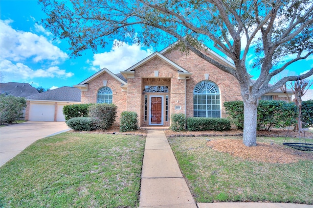 view of front of home with a garage and a front lawn