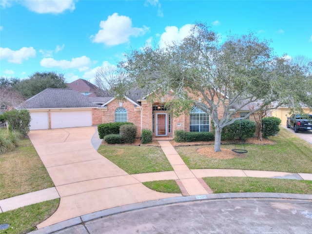 view of front facade with a garage and a front lawn