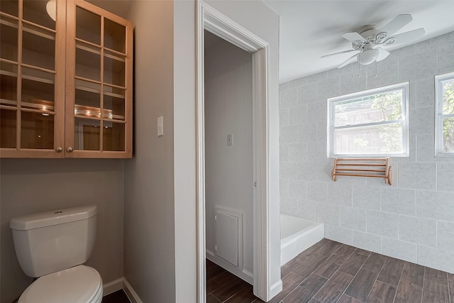 bathroom featuring ceiling fan and toilet