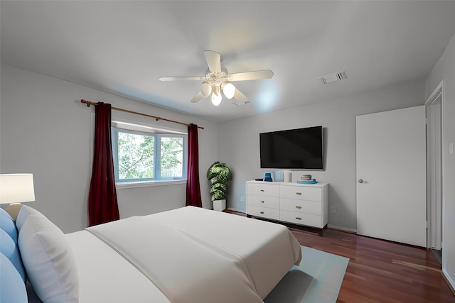 bedroom featuring dark hardwood / wood-style flooring and ceiling fan