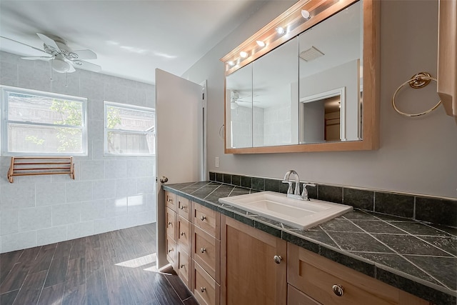 bathroom featuring vanity, hardwood / wood-style floors, and ceiling fan