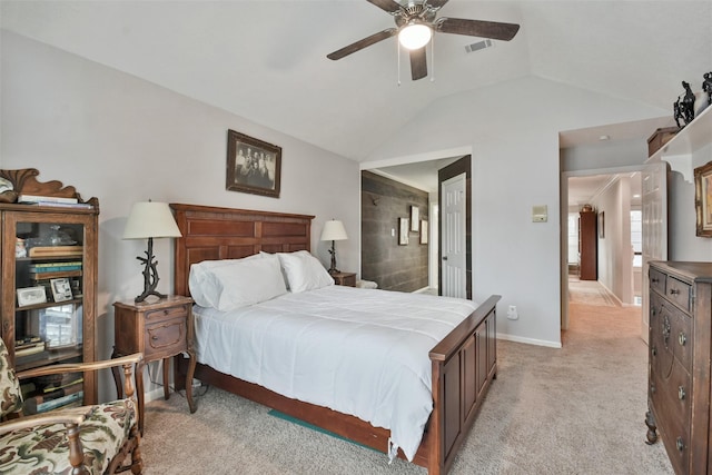 carpeted bedroom with vaulted ceiling and ceiling fan