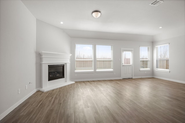 unfurnished living room featuring dark hardwood / wood-style flooring