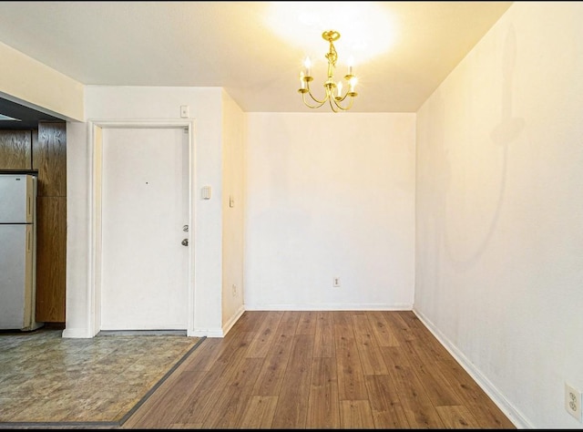 interior space featuring a notable chandelier and hardwood / wood-style floors