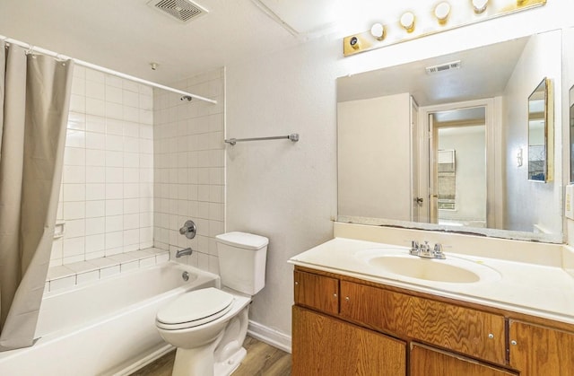 full bathroom with shower / bathtub combination with curtain, vanity, hardwood / wood-style floors, and toilet