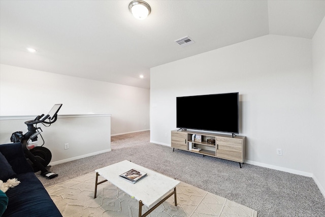 carpeted living room featuring lofted ceiling