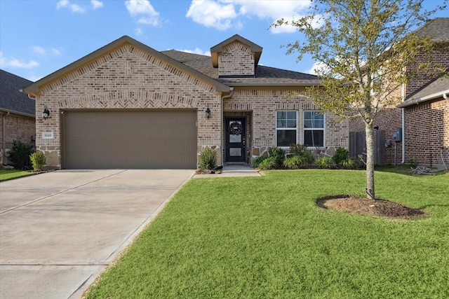 view of front facade with a garage and a front yard