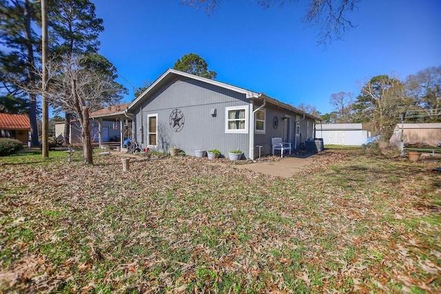 224 Sweetgum St, Trinity, TX 75862 - back of property featuring central air condition unit