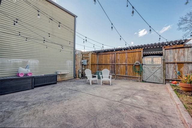 view of patio featuring fence