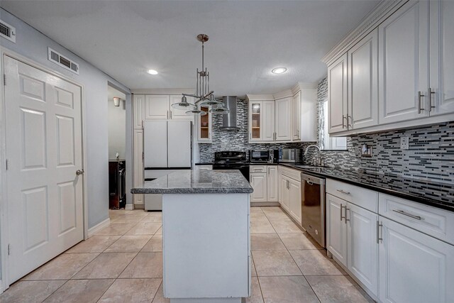 kitchen featuring electric range, visible vents, dishwasher, wall chimney exhaust hood, and a center island