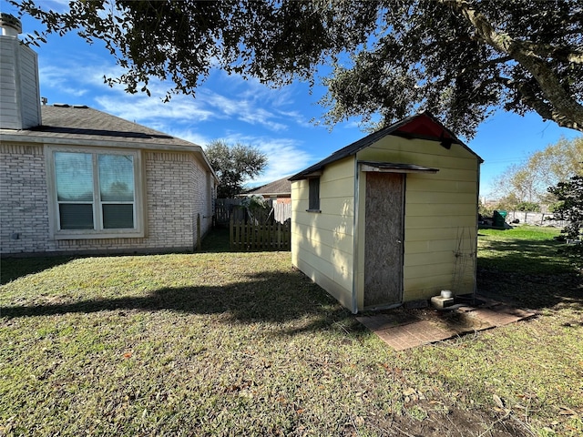 view of outbuilding featuring a lawn