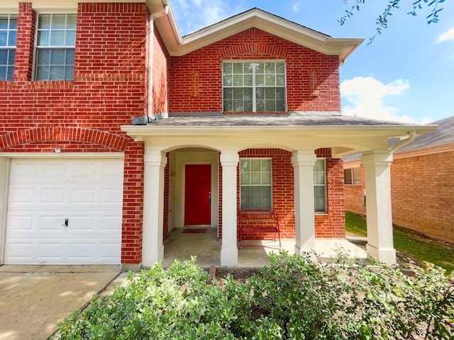 view of front of property with covered porch and brick siding