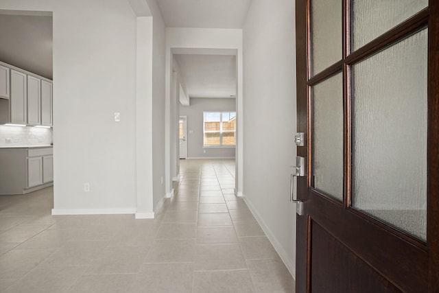 hallway with light tile patterned flooring