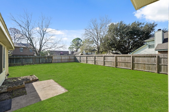 view of yard featuring a fenced backyard