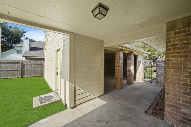 view of patio / terrace with fence and a gate