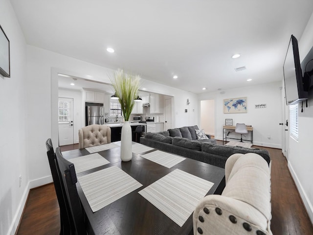 dining area featuring visible vents, baseboards, dark wood-style flooring, and recessed lighting