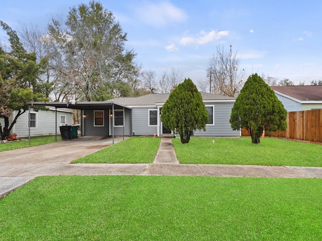 ranch-style home with a carport and a front lawn