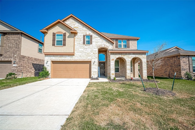 view of front of property featuring a garage, a front yard, concrete driveway, and stone siding