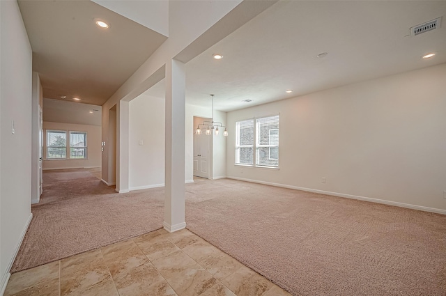 unfurnished room featuring visible vents, baseboards, light colored carpet, a chandelier, and recessed lighting