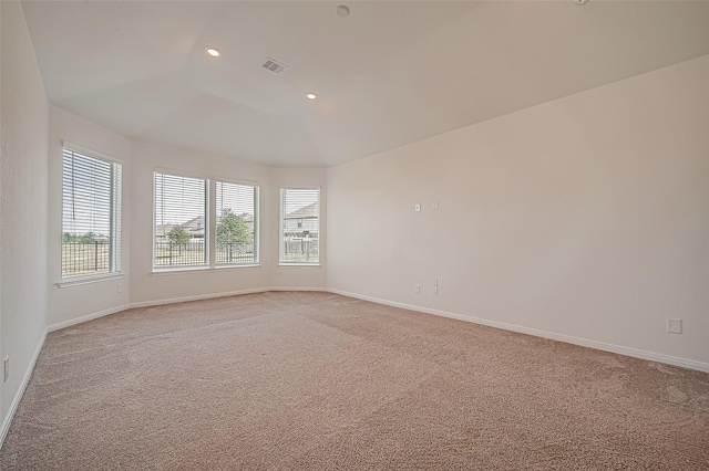 unfurnished room featuring recessed lighting, baseboards, visible vents, and light colored carpet