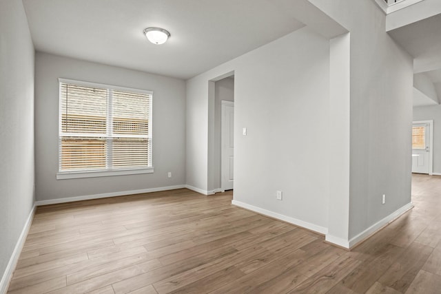 spare room featuring light hardwood / wood-style floors