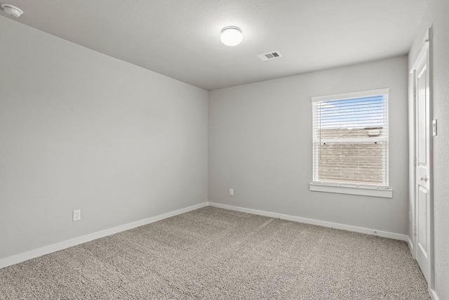 empty room featuring carpet flooring