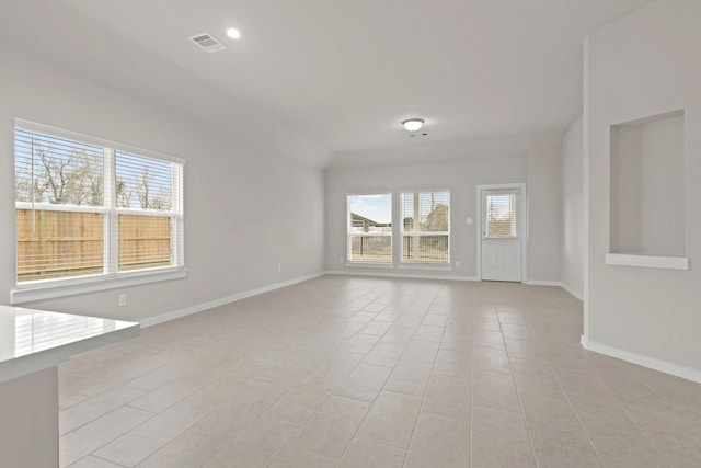 spare room featuring light tile patterned floors