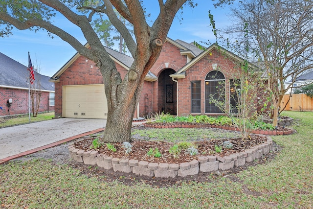 ranch-style house featuring a garage and a front lawn