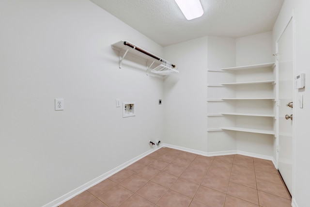 19110 Kelly Oaks Ct, Humble, TX 77346 - laundry room featuring laundry area, baseboards, hookup for a washing machine, hookup for an electric dryer, and hookup for a gas dryer
