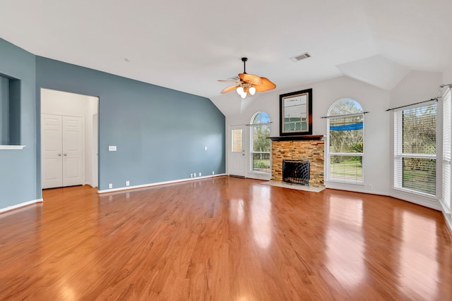 19110 Kelly Oaks Ct, Humble, TX 77346 - unfurnished living room with vaulted ceiling, a ceiling fan, light wood-type flooring, and visible vents