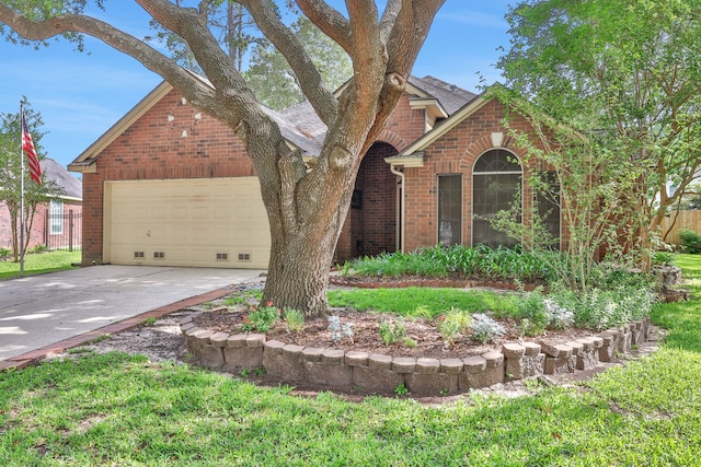 19110 Kelly Oaks Ct, Humble, TX 77346 - view of front facade with brick siding, a shingled roof, an attached garage, and driveway