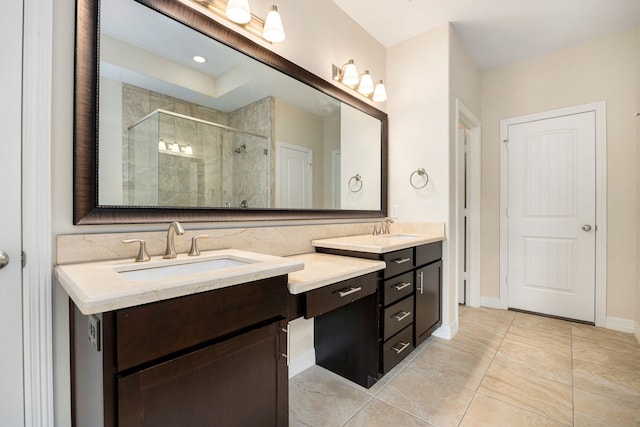 bathroom with vanity, tile patterned floors, and walk in shower