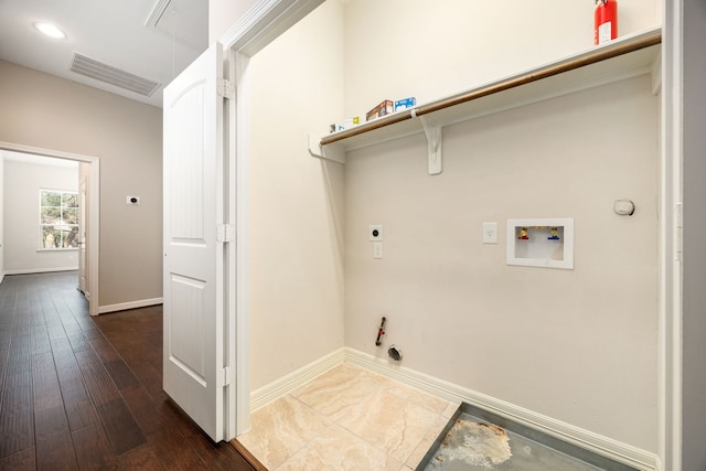 laundry room featuring gas dryer hookup, dark hardwood / wood-style floors, hookup for a washing machine, and electric dryer hookup