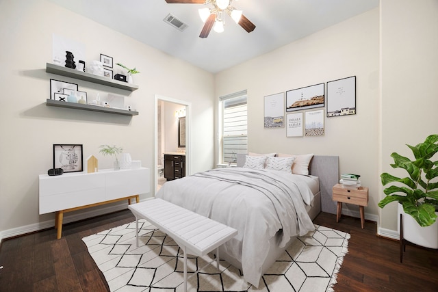 bedroom with dark hardwood / wood-style floors, ceiling fan, and ensuite bathroom