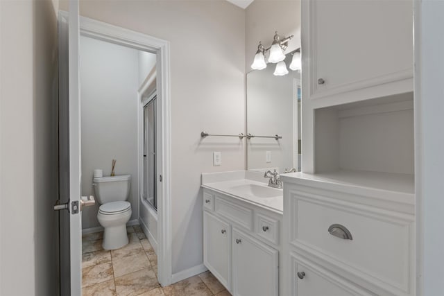 full bathroom with baseboards, shower / bath combination with glass door, vanity, and toilet