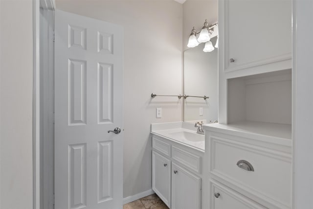 bathroom with baseboards and vanity