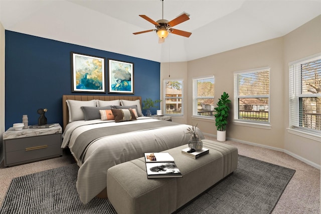 carpeted bedroom with vaulted ceiling, ceiling fan, and baseboards