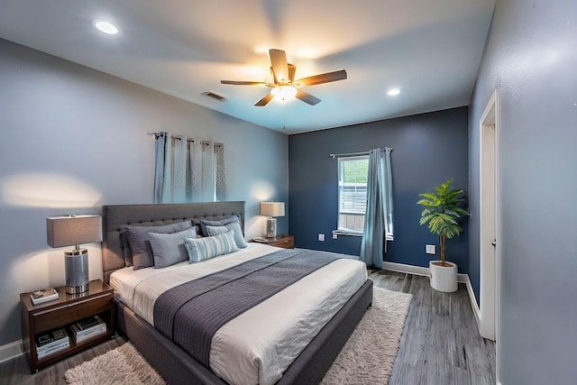 bedroom featuring ceiling fan and hardwood / wood-style floors