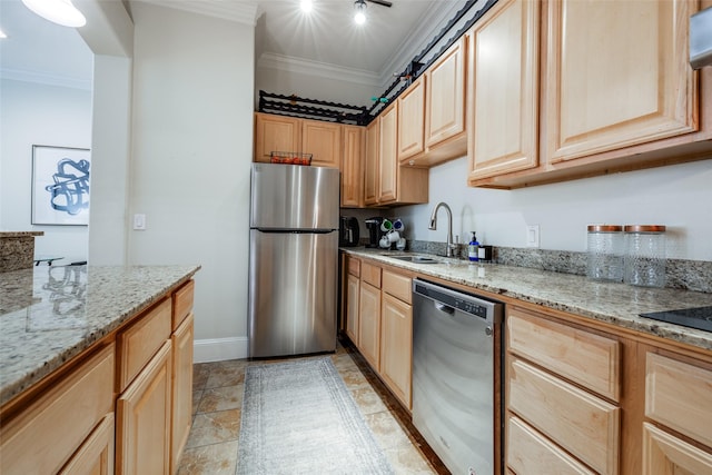 kitchen with light brown cabinetry, sink, ornamental molding, and stainless steel appliances