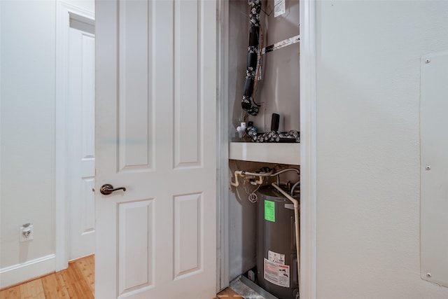 utility room with water heater