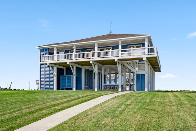 rear view of house with a lawn