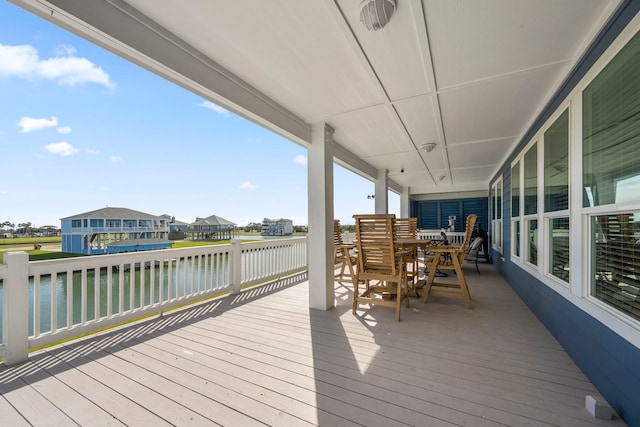 wooden deck featuring a water view