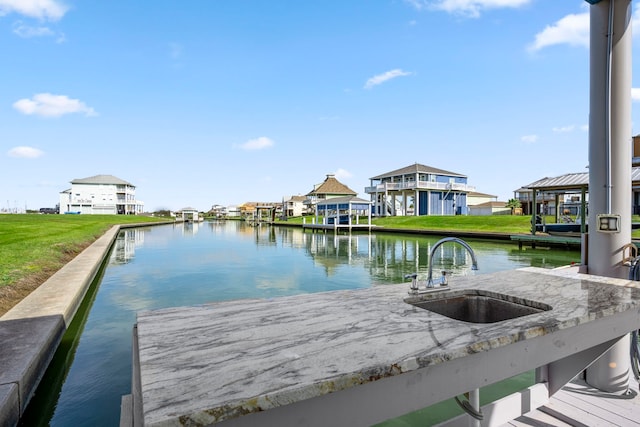 dock area with a water view and sink