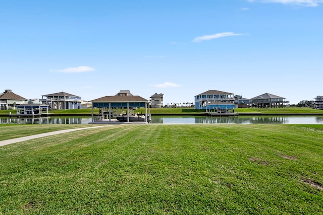 dock area featuring a yard and a water view